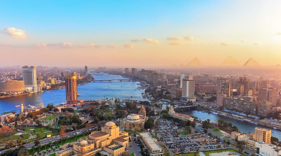 Collage of Cairo highlights including the Pyramids of Giza, Nile River, and bustling city streets